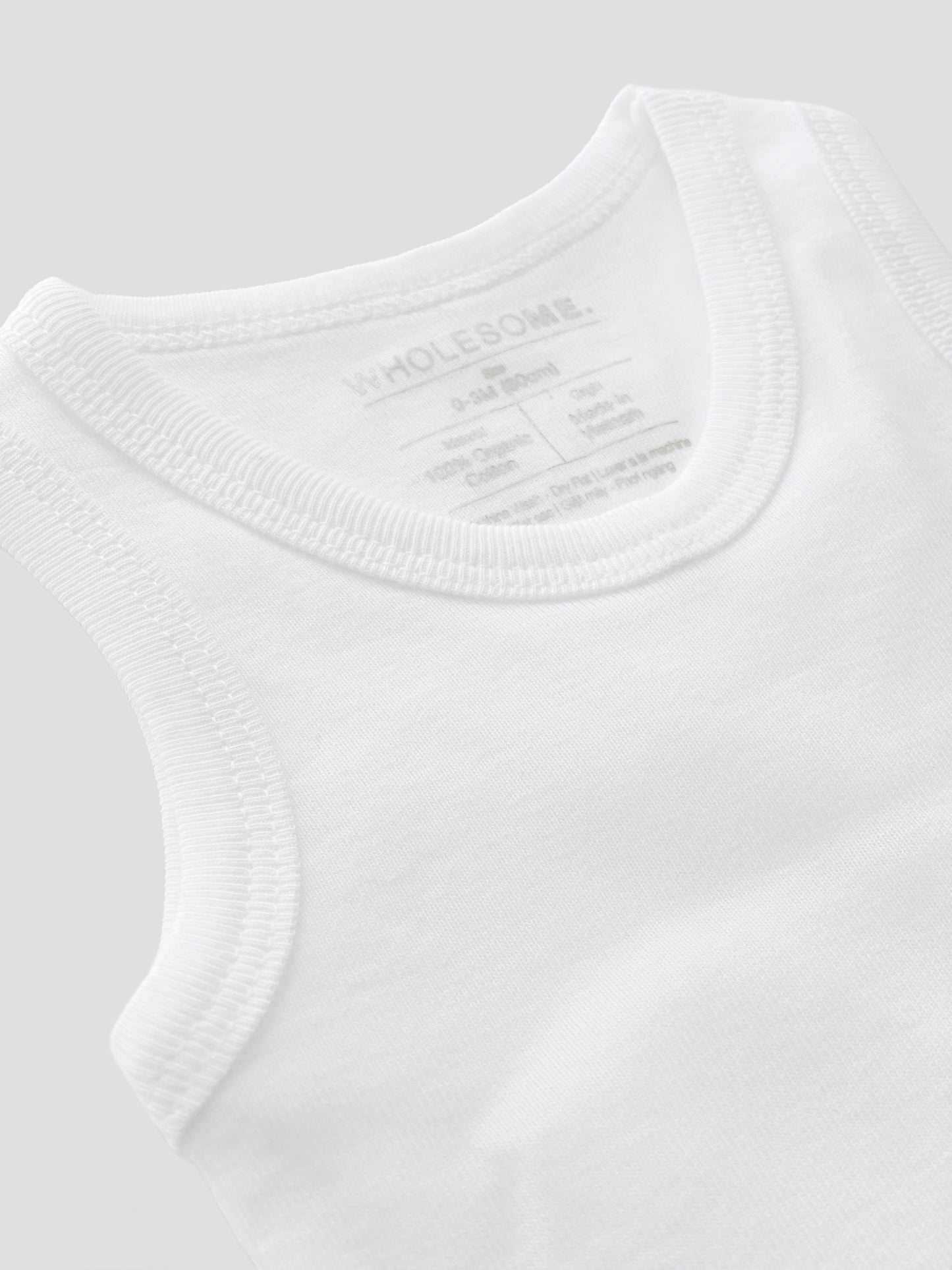 organic cotton, sleeveless, bodysuit, baby essentials, newborn, white, wrap, wholesome, oeko tex standard 100,