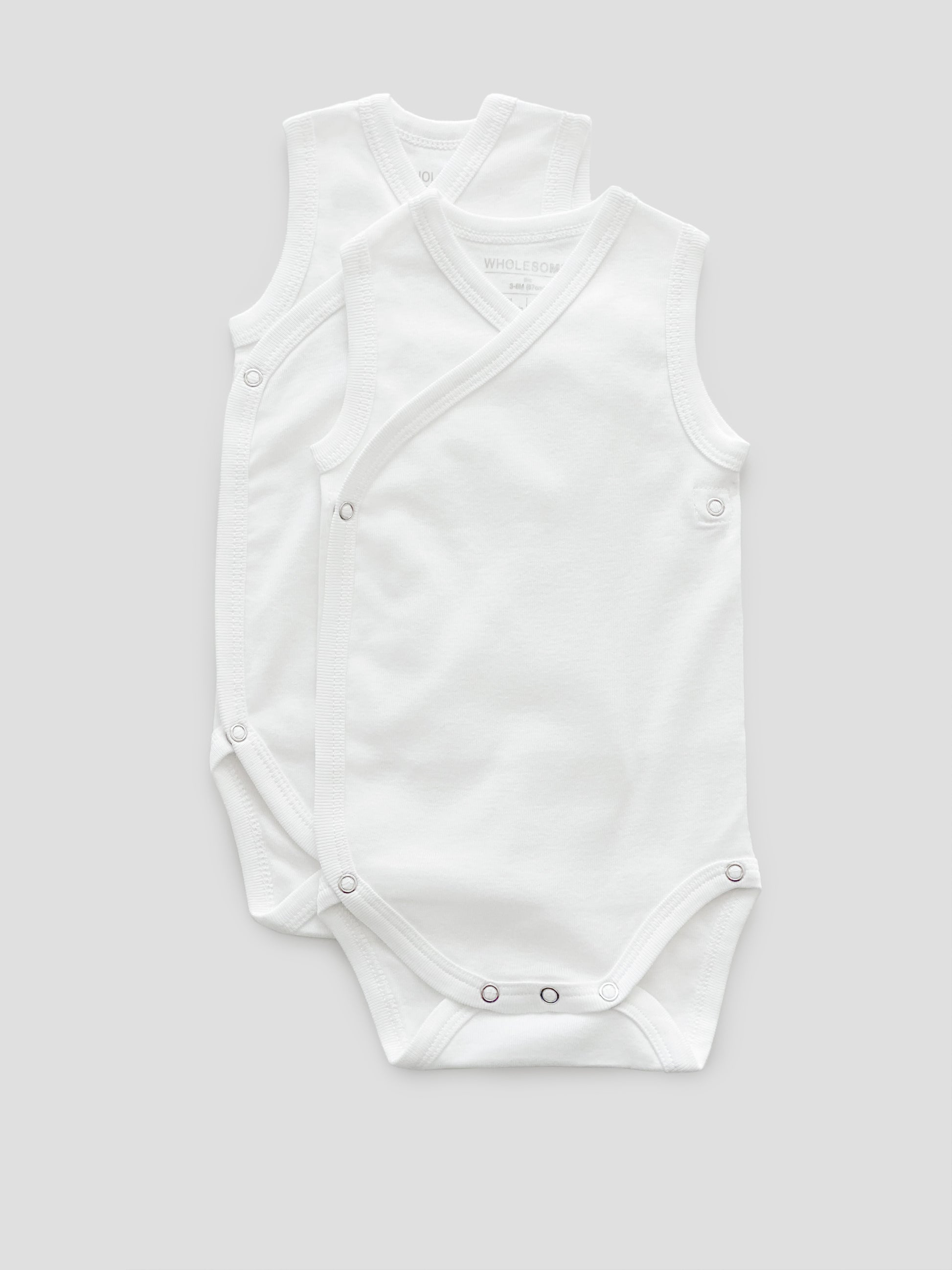 Baby organic rib white cotton bodysuit sleeveless with buttons 2 pack –  Wholesome